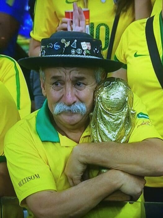 Man Holding World Cup