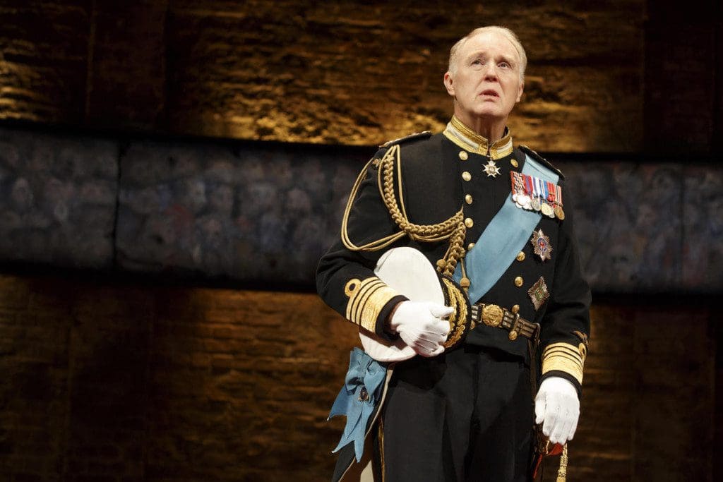 This image released by The O + M Co. shows Tim Pigott-Smith during a performance of "King Charles III," at the Music Box Theatre in New York. Pigott-Smith stars in Mike Bartletts King Charles III, an ingenious view of what might happen when the Prince of Wales finally inherits the throne. It was the winner of the 2015 Olivier Award for Best New Play. (Joan Marcus/The O + M Co. via AP)