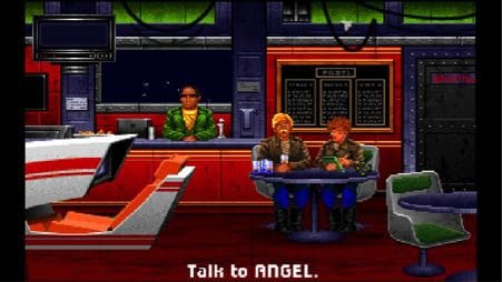 The bar of the Tiger's Claw. You can talk to the three characters, read the dynamically updating killboard, and play the mission simulator. Since characters could die in combat, their chairs would be empty if they had been killed.